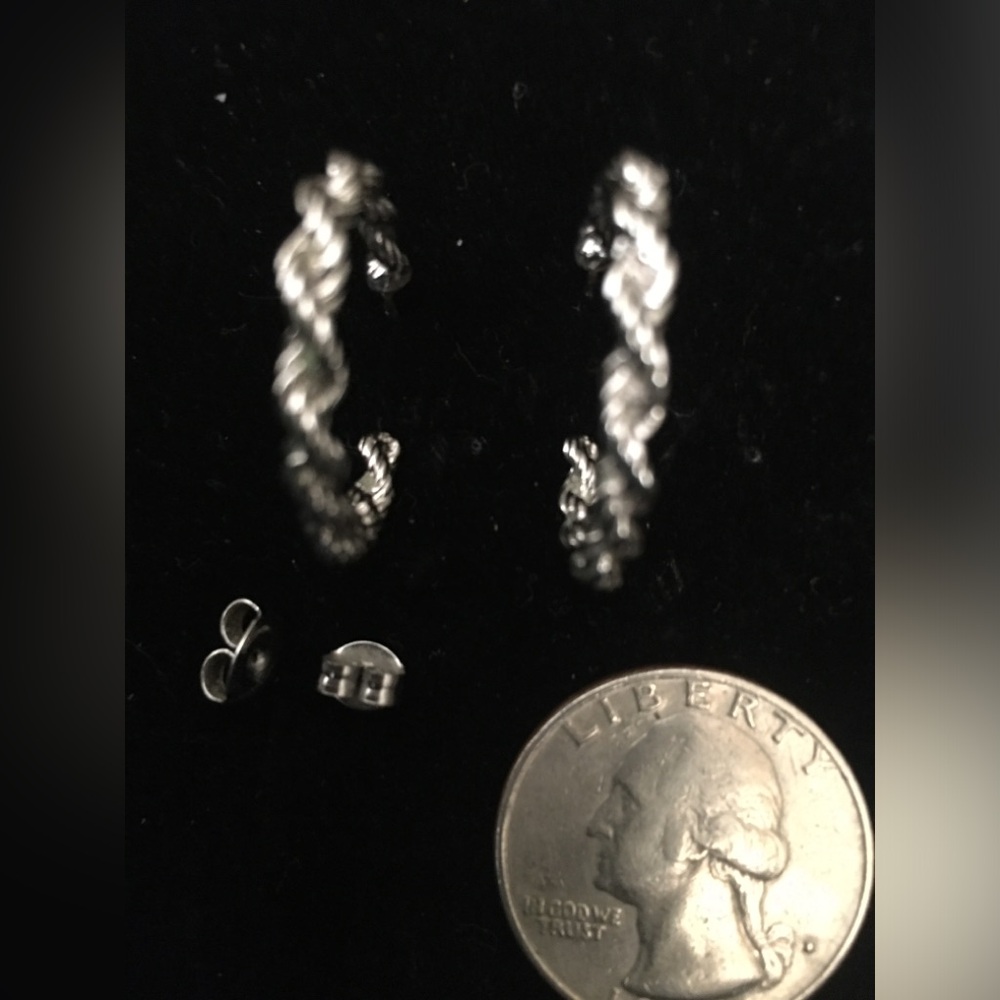 Silver colored hoop earrings.